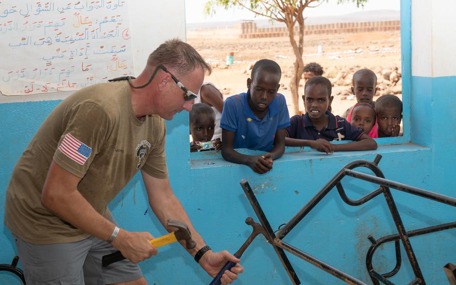 U.S. service members deployed to Camp Lemonnier repaired desks and delivered picnic tables in support of the 450th Civil Affairs Battalion renovation project at a primary school in Ali Oune, Djibouti, June 7, 2023.