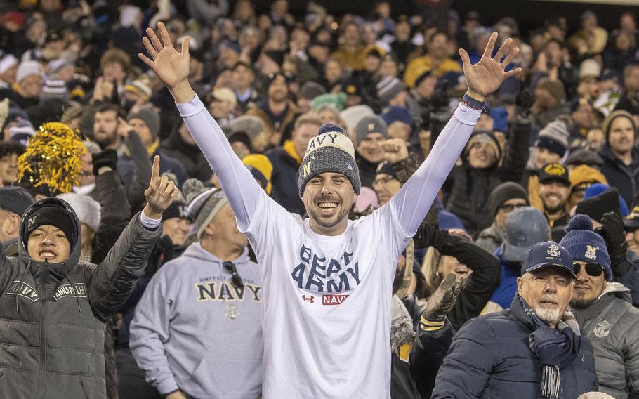 Navy fans celebrate after the Midshipmen scored a touchdown during overtime play in the 123rd Army-Navy game played Saturday, Dec. 10, 2022, at Philadelphia’s Lincoln Financial Field.  An extra point moments later tied the game at 17. The Army Black Knights went on to win 20-17 in double overtime.