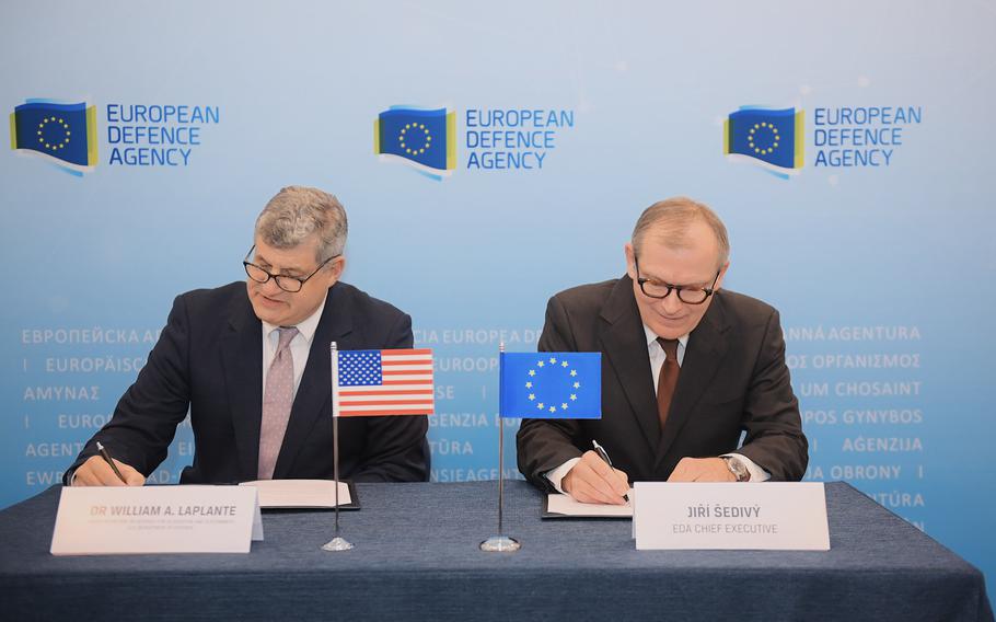 European Defence Agency Chief Executive Jiří Šedivý, right, and U.S. Undersecretary of Defense for Acquisition and Sustainment William LaPlante sign an administrative agreement in Brussels, Belgium, on Wednesday, April 26, 2023, that aims to deepen security ties and expand communication and cooperation among the United States and nations of the European Union. 
