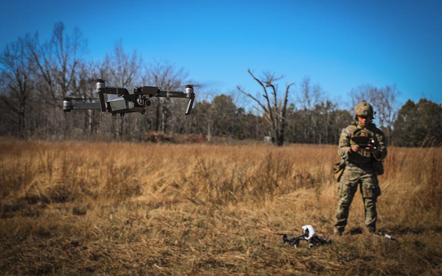 A U.S. soldier operates a commercial drone to film Green Berets conducting demolition training at Fort Campbell, Ky, on Oct. 25, 2017. 