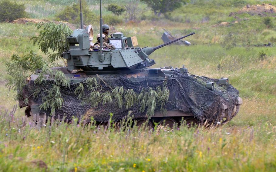 A Bradley fighting vehicle rolls across the range during a live-fire demonstration at the training area in Cincu, Romania, in 2017. The U.S. is sending Bradleys to Ukraine to help the country defend itself as fighting with Russia continues.