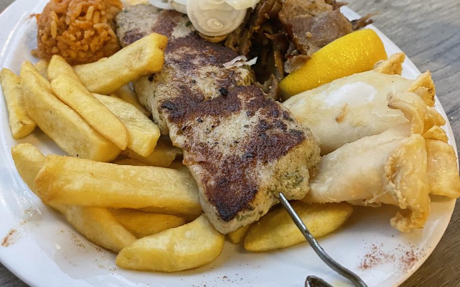 The Poseidon plate at Pallas Greek restaurant lives up to its epic name. It features gyro meat, souvlaki, calamari with tzatziki, fries and rice.