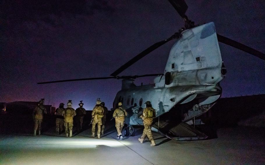 Taliban fighters from the Fateh Zwak unit, wielding American-supplied weapons, equipment and uniforms, storm into the Kabul International Airport to secure the airport and inspect the equipment that was left behind after the U.S. military completed their withdrawal, in Kabul, Afghanistan, on Aug. 31, 2021. 