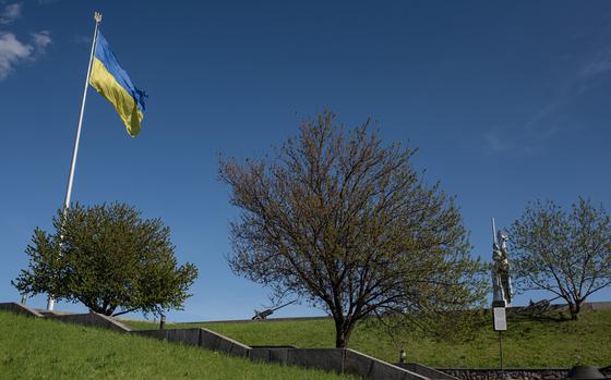 A giant Ukrainian national flag is seen next to the "Mother Motherland" monument, on May 9, 2022 in Kyiv, Ukraine. (Alexey Furman/Getty Images/TNS)