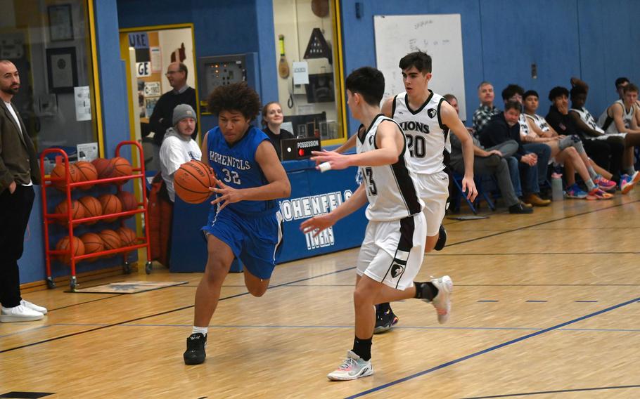 Hohenfels’ Cameron Sanchez drives and scores at the hoop during the second half of a game against AFNORTH at Hohenfels High School on Jan. 13, 2024. 