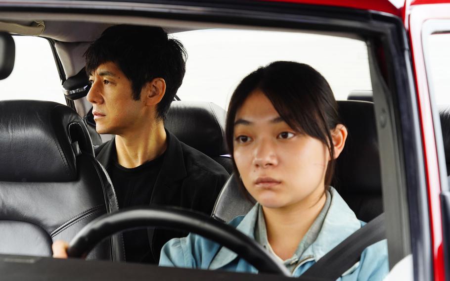 Hidetoshi Nishijima, left, and Toko Miura in a scene from “Drive My Car.” 