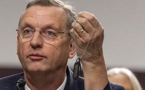 VA Secretary nominee Doug Collins holds up his dogtags on Tuesday, Jan. 21, 2025 during his confirmation hearing at the U.S. Senate Committee on Veteran Affairs in Washington. Eric Kayne/Stars and Stripes)