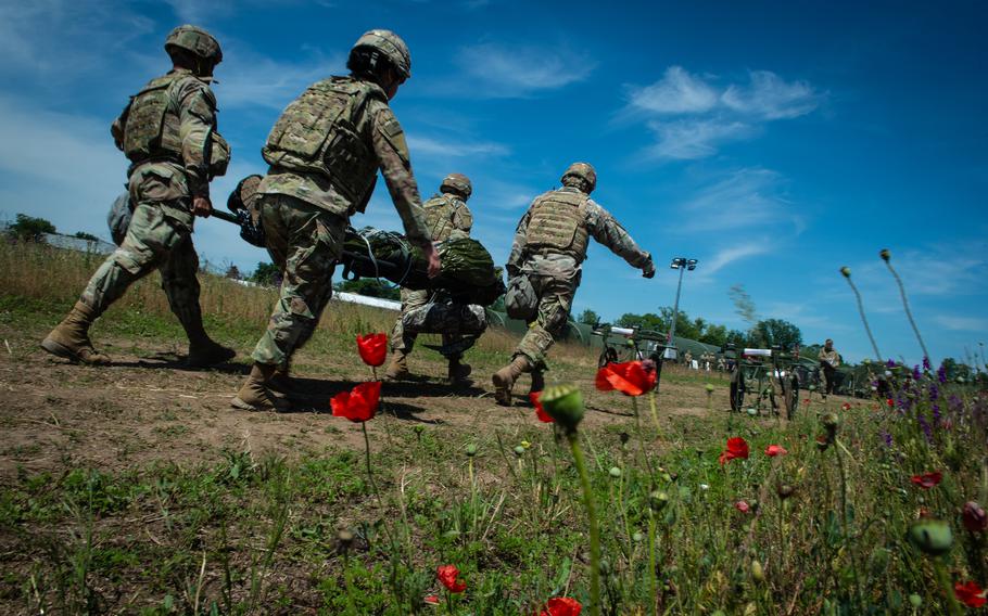 Army Brig. Gen. Clinton Murray is carried to a medical field hospital near Bordusani, Romania, on June 6, 2023, during Exercise Saber Guardian. Murray received simulated care in various stages of combat evacuation.