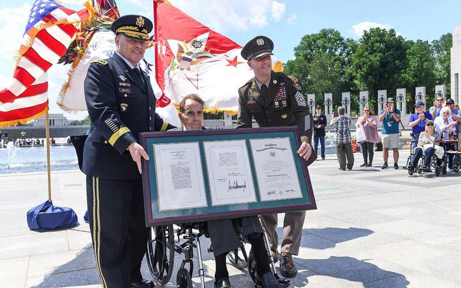 Former U.S. senator Robert Dole was promoted to the honorary rank of colonel in a ceremony presided over by Army Chief of Staff Gen. Mark Milley, at the World War II Memorial on the National Mall, May 16, 2019. At right is Sgt. Maj. of the Army Daniel A. Dailey.