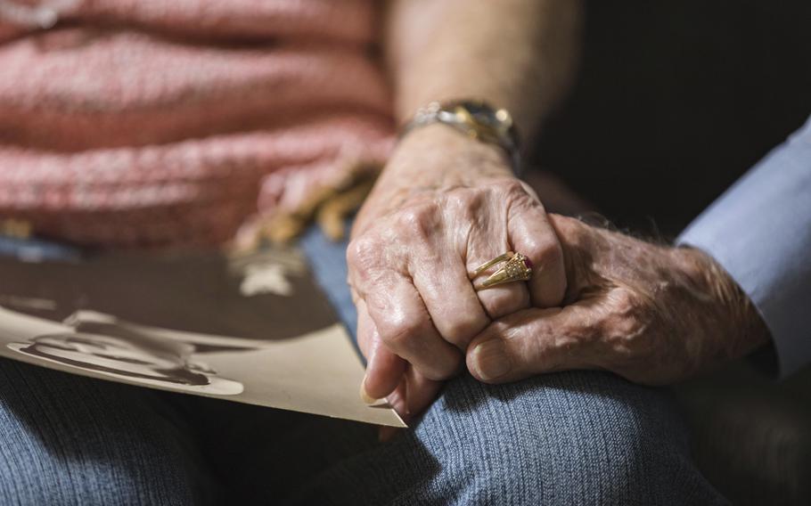 Thomas and Dee House hold hands at their home in Las Cruces, N.M., on Aug. 26, 2021, after 75 years of marriage. “This is supposed to be the marriage that wouldn’t last,” Thomas said. But two daughters, seven grandchildren and seven great-grandchildren later and they’re still the best of friends.