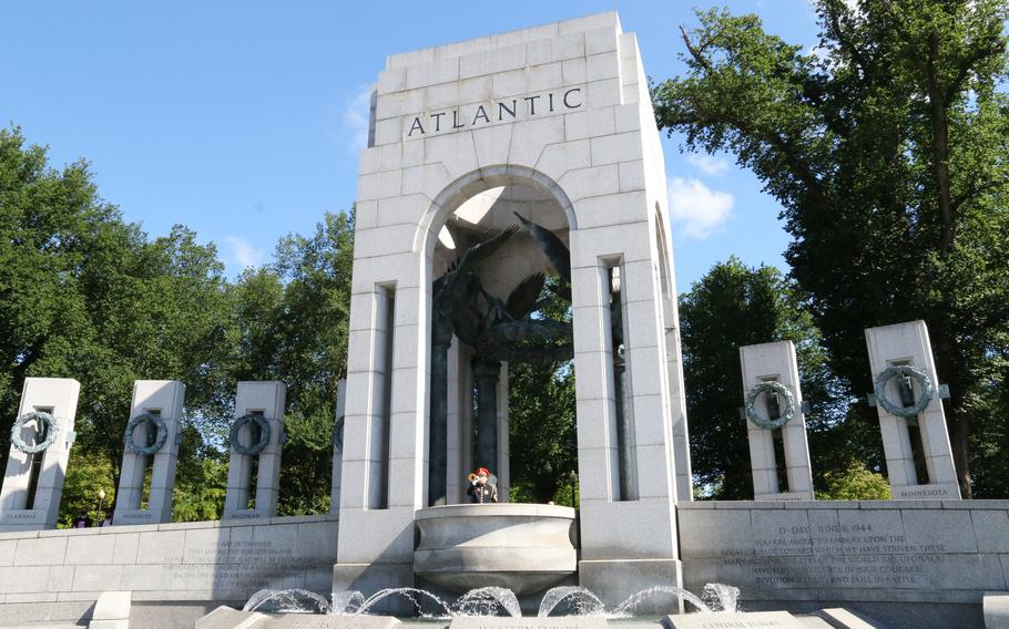 A bugler plays taps during a Memorial Day ceremony at the National World War II Memorial in Washington, D.C., May 31, 2021.