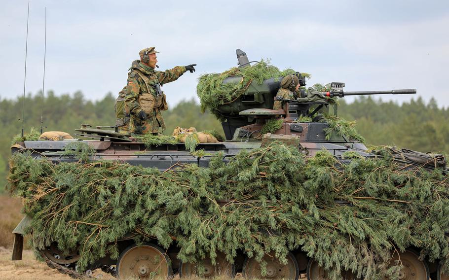 German soldiers advance during a field training exercise with NATO allies at Mielno Range, Poland, on May 14, 2022. A poll released Oct. 17, 2022, found that the bulk of respondents oppose a military leadership role for Germany in Europe.