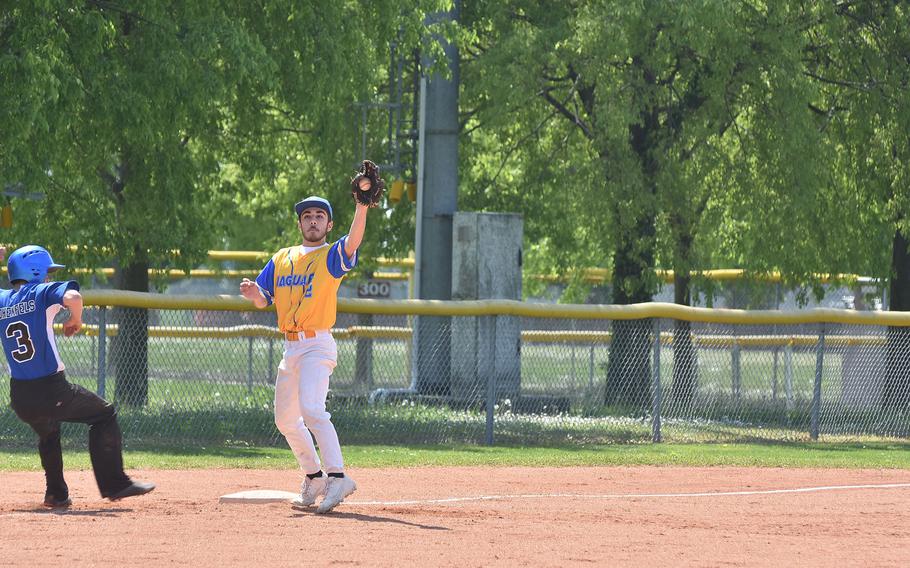 Hohenfels' Nathan Angulo gets back to third base safely before Sigonella's Teven McCarthy can tag him on Saturday, April 30, 2022.