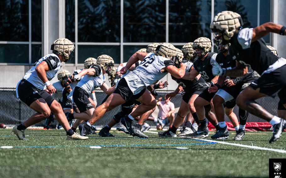 Army football players run a drill during the first week of 2023 fall camp. The Black Knights are implementing a new offensive scheme during the first season under offensive coordinator Drew Thatcher, moving away from decades of the triple option.