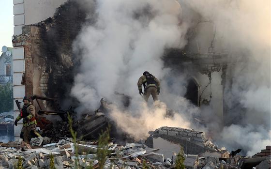 Rescuers work at a house after a Russian missile attack in Kharkiv, Ukraine, on May 10, 2024.
