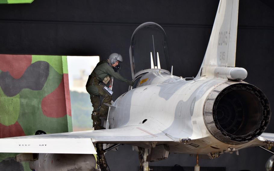 A Taiwanese air force pilot climbs out of a Mirage 2000 fighter jet after a demonstration flight over Hsinchu Air Base, Taiwan, Wednesday, Jan. 11, 2023. 