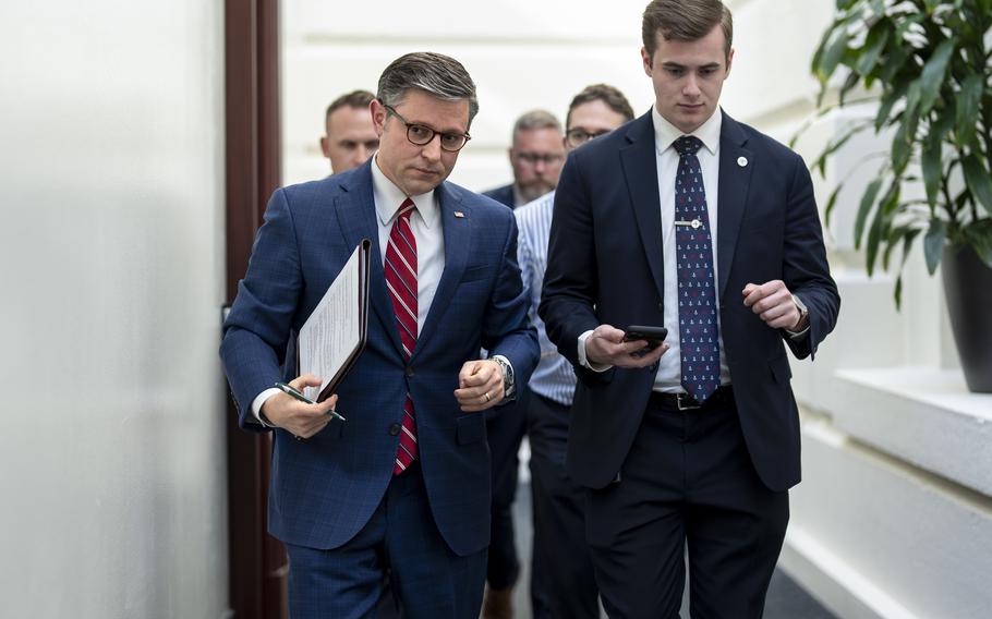 House Speaker Mike Johnson, R-La., left, arrives for a closed-door meeting with fellow Republicans at the Capitol in Washington, Monday, April 15, 2024.