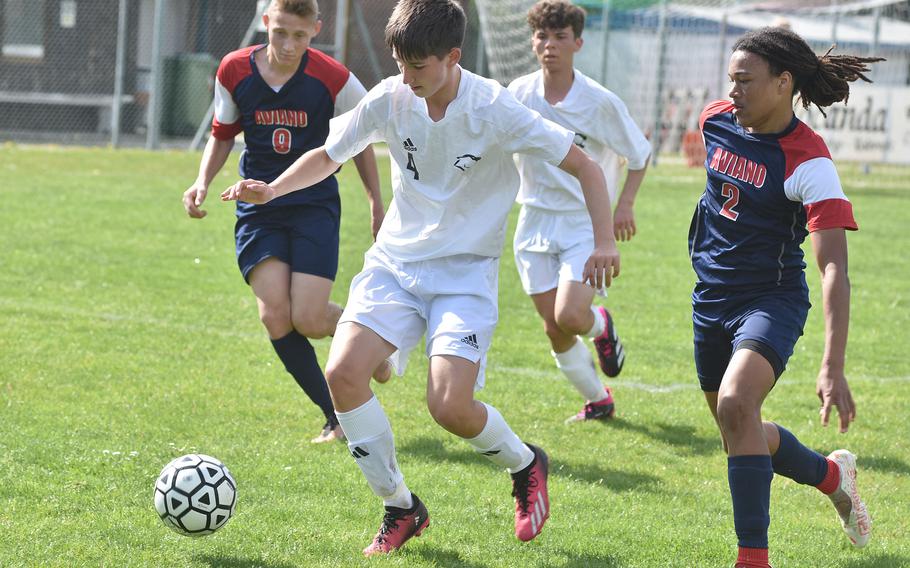 Vicenza's Jacob McGovern tries to dribble while Aviano's Anthony Davis, left, and Andrew Walker close in on Saturday, April 22, 2023.