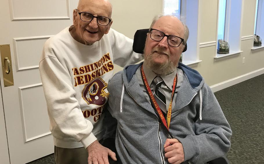 Army Veteran BIll Meck poses with his father, the late William H. Meck Jr, also a veteran, at Charlotte Hall Veterans Home in Charlotte Hall, Md., in 2019.