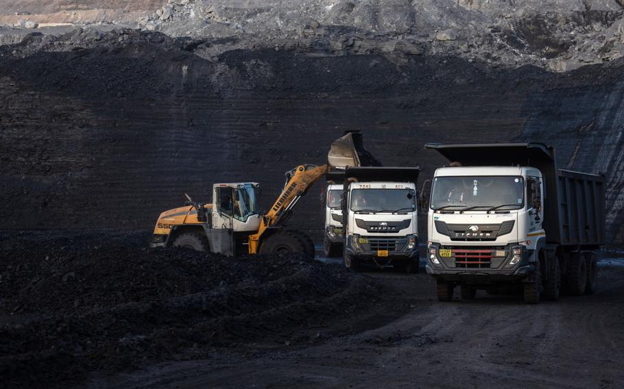 Dump trucks at a coal mine in Chhattisgarh, India, in May. MUST CREDIT: Bloomberg photo by Anindito Mukherjee