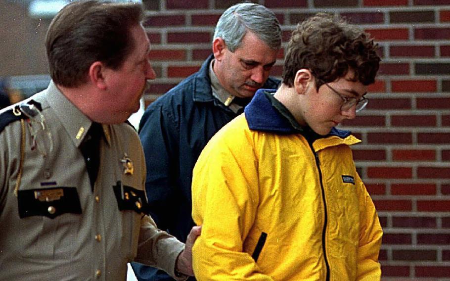 Heath High School shooting suspect Michael Carneal is escorted out of the McCracken County Courthouse after his arraignment in Paducah, Ky., Jan. 15, 1998. Carneal was accused of opening fire inside a Kentucky high school, killing three classmates and wounding five others Dec. 1, 1997. In the quarter century that has passed, school shootings have become a depressingly regular occurrence in the U.S. Carneal's parole hearing in September 2022 raises questions about the appropriate punishment for children who commit heinous crimes. Even if they can be rehabilitated, many wonder if it is fair to the victims for them to be released.
