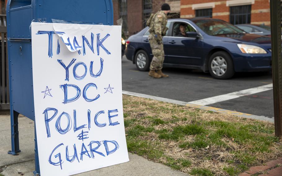 A sign was posted in support for the Army and Air National Guard members providing security at a traffic control point in Washington, D.C., on Jan. 16, 2021. Pentagon officials said Tuesday, Feb. 22, 2022, that they are considering a request by Washington officials for Guard troops to assist law enforcement with traffic control ahead of a trucker protest planned in and around the U.S. capital starting this week.