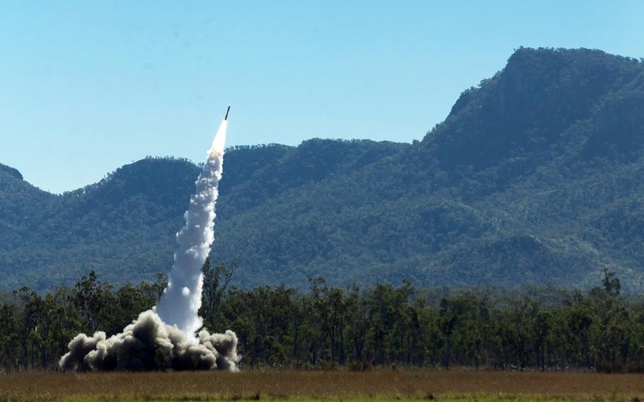 Marines from 3rd Battalion, 12th Marine Regiment, 3rd Marine Division launch an M-270 Guided Multiple Launch Rocket System from Shoalwater Bay Training Area, Australia, July 19, 2021, during exercise Talisman Sabre.