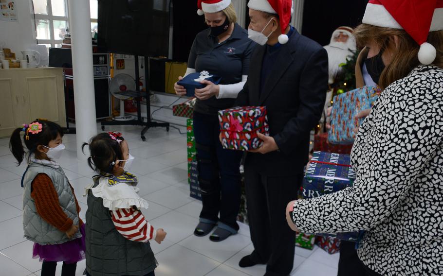 Members of Eighth Army headquarters and their families donated enough toys and bikes to ensure each child at Namsan-won Orphanage in Seoul, South Korea, receives a gift on Christmas Eve. 
