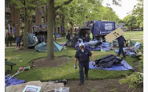 Chicago police have closed off the campus quad after dismantling a pro-Palestinian encampment at DePaul University in Chicago, Thursday, May 16, 2024. The encampment was taken down in the early morning, hours after the school's president told students to leave the area or face arrest. Students at many college campuses this spring set up similar encampments, calling for their schools to cut ties with Israel and businesses that support it, to protest Israel's actions in the war with Hamas. (AP Photo/Teresa Crawford)