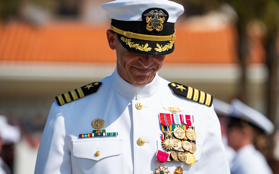 A sailor smiles.