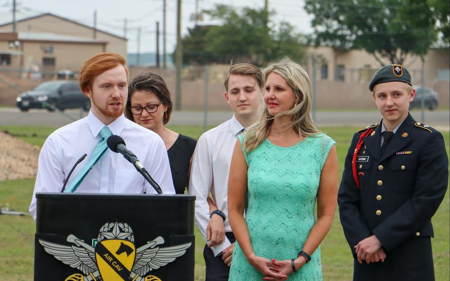 Michael DeFrenn, son of Chief Warrant Officer 2 Jason DeFrenn, gives a dedication speech during a ceremony May 4, 2023, to rename an airfield at Fort Cavazos, Texas, in honor of his father and Chief Warrant Officer 4 Keith Yoakum. The two men died in combat in Iraq in 2007. 