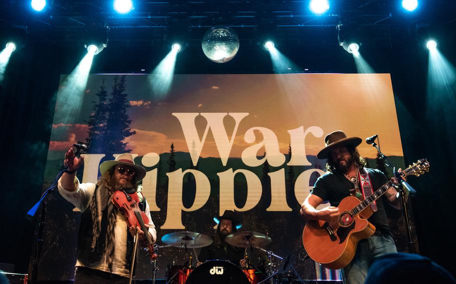 Country music duo War Hippies perform March 9, 2023, at MadLife Stage & Studios in Woodstock, Ga., just north of Atlanta, during their 2023 tour in support of their self-titled debut album. Both War Hippies members, Marine veteran and guitarist Scooter Brown, right, and Army veteran and violinist Donnie Reis, left, are Iraq War veterans.