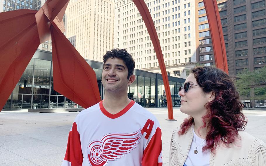 Cameron and Sloane walk by Alexander Calder’s “Flamingo” sculpture at Federal Plaza. 