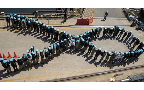 220429-N-CJ603-1030

NORFOLK (April 29, 2022) – Sailors assigned to the amphibious assault ship USS Wasp (LHD 1) pose for a photo on a pier at BAE Systems Shipyard, April 29, 2022. Sailors stood in the shape a ribbon while holding teal paper to show support for sexual assault victims. (U.S. Navy photo by Mass Communication Specialist Seaman Amber Speer)