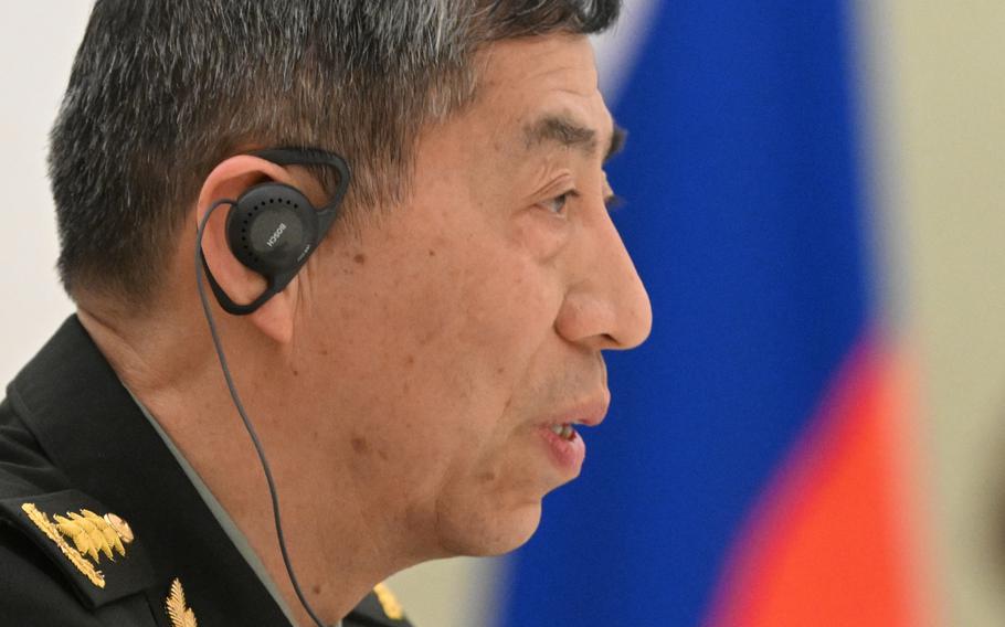 China Defense Minister Gen. Li Shangfu speaks to Russian President Vladimir Putin and Russian Defense Minister Sergei Shoigu during their meeting at the Kremlin in Moscow, Russia, on April 16, 2023. 