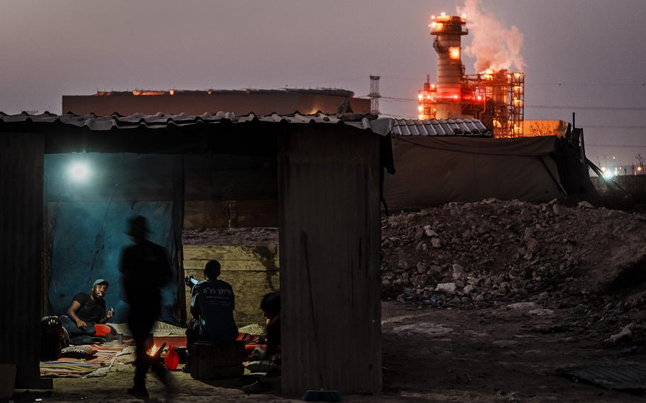 The village of Wadi al Naam, a collection of dilapidated, low-slung buildings in the Negev desert, sits in the shadow of a power plant. But the illegal status of the Bedouin village means it can’t connect to the electrical grid.