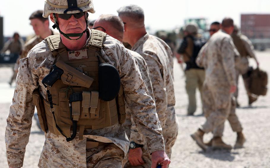 U.S. Marine Maj. Gen. Richard Mills walks off the flight line at Bastion airfield, Camp Leatherneck, Afghanistan, in April 2010. Now a retired lieutenant general, Mills said that many U.S., British, Afghan and allied troops sacrificed greatly in pursuit of a modernized Afghanistan. 