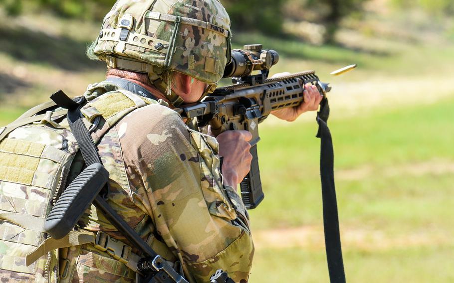 A soldier shoots the Sig Sauer-built Next Generation Squad Weapon rifle, which will be known as the M7, during the Best Ranger Competition at Fort Benning, Ga. , on April 14, 2023. Army officials told lawmakers April 26 that they expect some soldiers to receive the new weapons in 2024. 