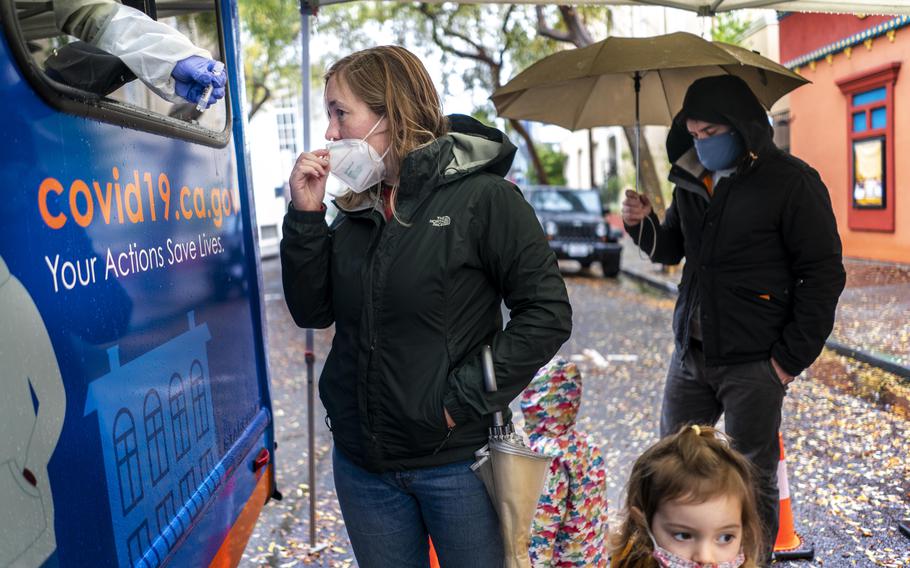 People in Berkeley, Calif., get coronavirus tests on Dec. 29. Lines have grown longer as California experiences a surge in coronavirus cases. 