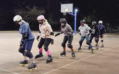 Fuji Flatliners learn to shuffle-step during roller derby practice at Yokota Air Base, Japan, on Feb. 28, 2022. 