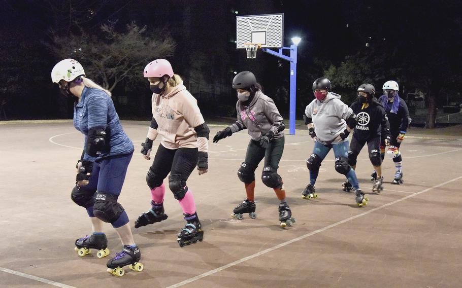 Fuji Flatliners learn to shuffle-step during roller derby practice at Yokota Air Base, Japan, on Feb. 28, 2022. 