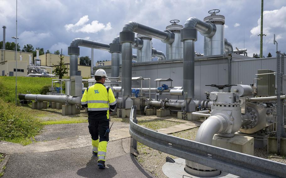 An employee of Uniper Energy Storage walks through the above-ground facilities of a natural gas storage facility  at the Uniper Energy Storage facility in Bierwang, Germany, on June 10, 2022. 