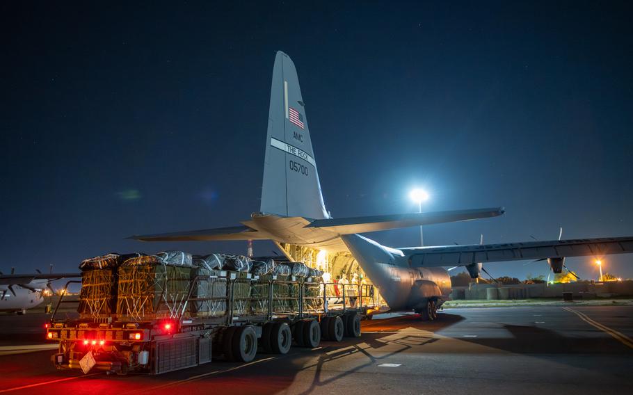 Pallets of food and water destined for a Gaza airdrop are loaded aboard a C130-J Hercules on March 1, 2024.