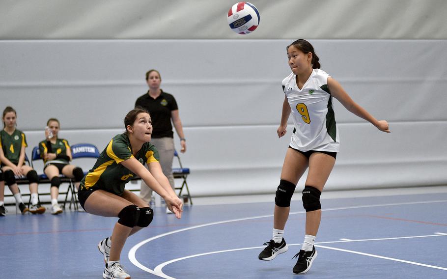 SHAPE junior Juliette Laforest, left, bumps the ball while teammate Lily Tjeltveit, right, jumps out of the way during a Sept. 1, 2023, scrimmage at Ramstein High School on Ramstein Air Base, Germany.