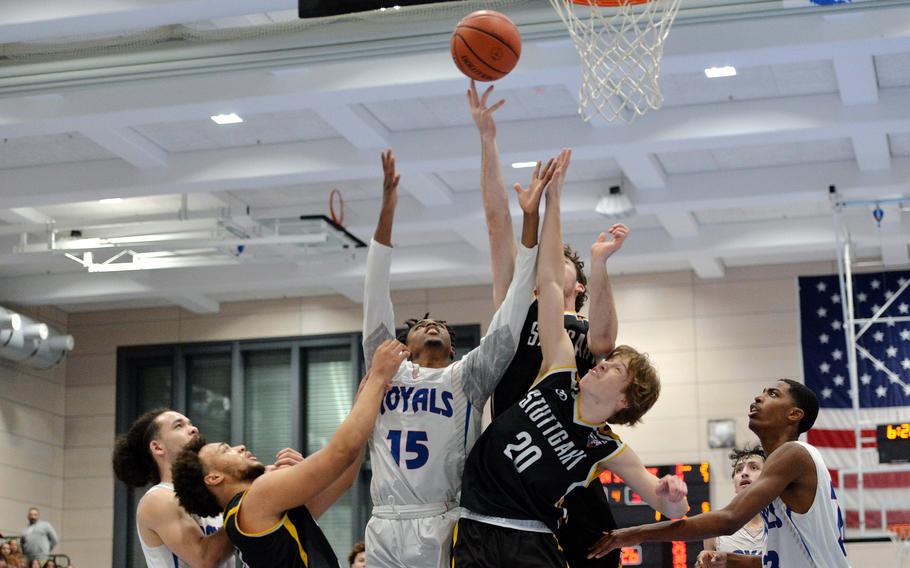 The Royals and Panthers battle for a rebound in an exciting, hard-fought Division I championship game at the DODEA-Europe basketball championships in Ramstein, Germany, Feb. 18, 2023. Stuttgart took title with a 62-60 double overtime win.