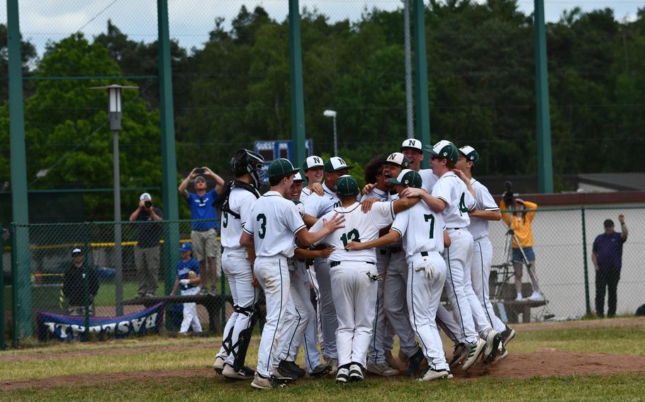 Naples celebrates its DODEA-Europe Division II/III baseball title on Saturday, May 21, 2022, after defeating Aviano 13-4 in the final.