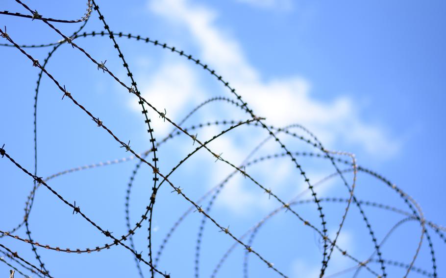 Concertina and barbed wire top a fence near the Demilitarized Zone between North and South Korea.