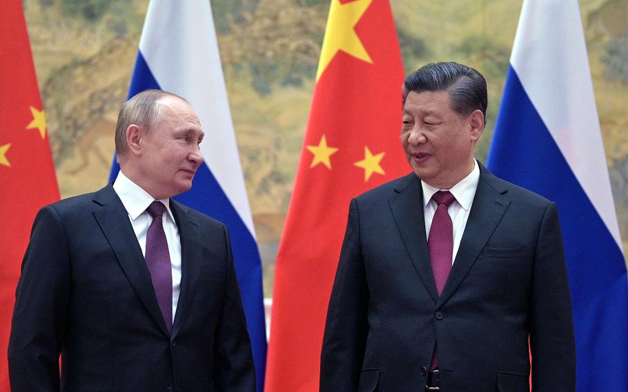 Russian President Vladimir Putin, left, and Chinese President Xi Jinping meet in Beijing, on Feb. 4, 2022. 