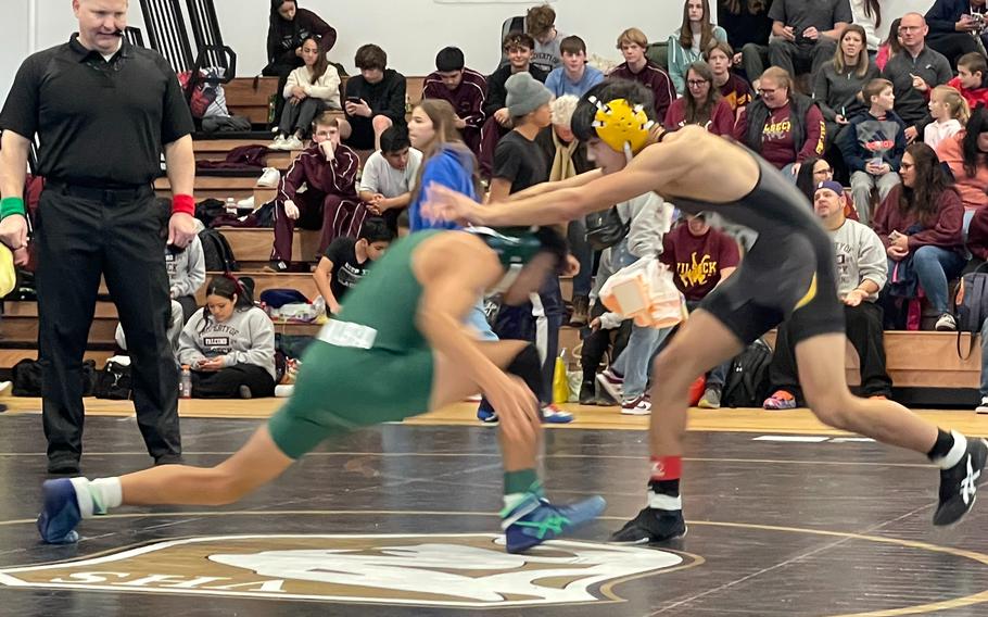 Ankara wrestler Caleb Figueroa attempts to take down Kyler Mukai from Vicenza during the Vicenza Italian Medallion Battle “Uno” wrestling tournament at Vicenza High School, Italy, Jan. 13, 2024. Figueroa won the match by decision, 12-8. 