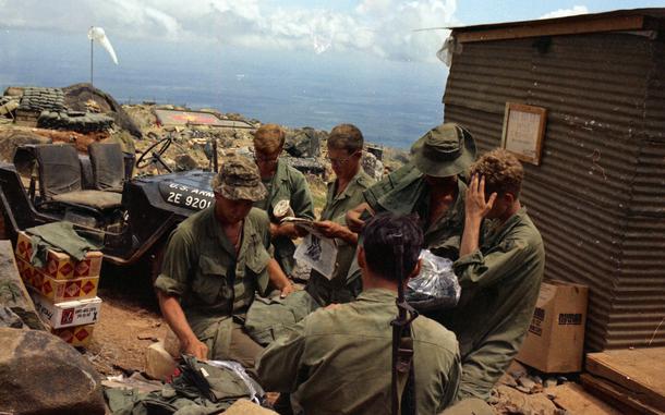 Hed: Neither mortars nor bullets nor heat nor gloom of fight, 1969

Black Virgin Mountain, Vietnam: A soldier outside the "Nui Ba Den Post Exchange and Mail Room" checks out an issue of the Pacific Stars and Stripes that was just delivered. 

Although not the U.S. Postal Service, Stars and Stripes' logistic men managed to get the paper even onto the rocky outpost atop Black Virgin Mountain (Nui Ba Den), a solitary block of granite that juts 3,200 feet in the air above Tay Ninh, South Vietnam. All supplies have to be delivered by helicopter.

Throughout the decades, Stars and Stripes has used whatever means needed to get a paper copy to its readers, whether by helicopter, jeep or donkey. 

Find out more about Stars and Stripes Pacific's history on our special 80th anniversary section here.
https://80.stripes.com/80th-home

META TAGS: SSP 80th anniversary; Vietnam War; mountain; summit; outpost; camp; base; U.S. Army; military life; mail; servicemember; Stars and Stripes history; jeep